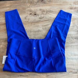 Athleta Salutation Stash 7/8 Tight Leggings. Size large NWT purple